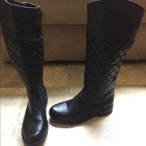 Black quilted up to the knee boots